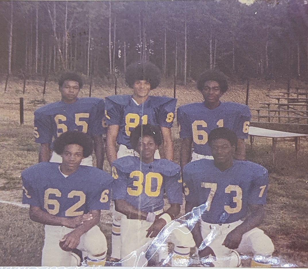click to see item Six Football players in a Blue Uniform